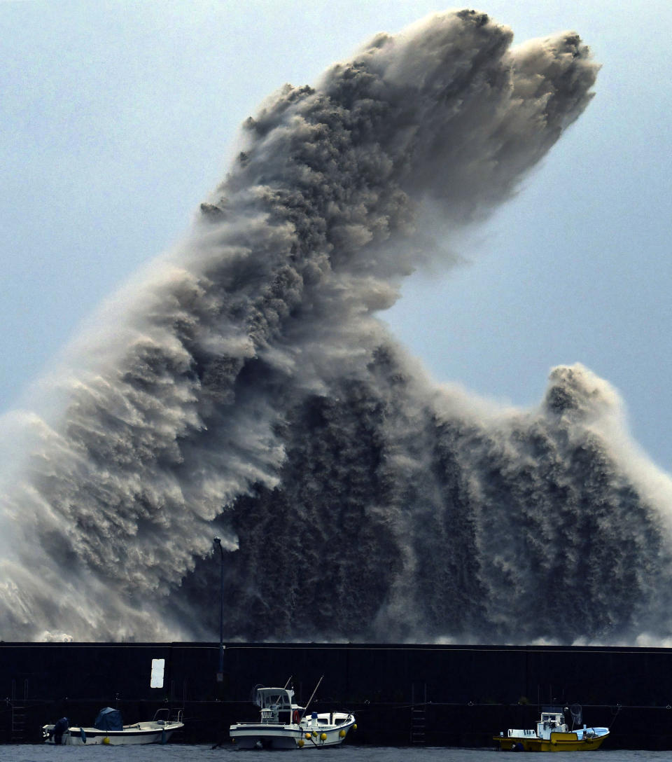 High wave hits a breakwater in Aki city, Kochi prefecture, western Japan as a typhoon Cimaron approached the area. (Chika Oshima/Kyodo News via AP)