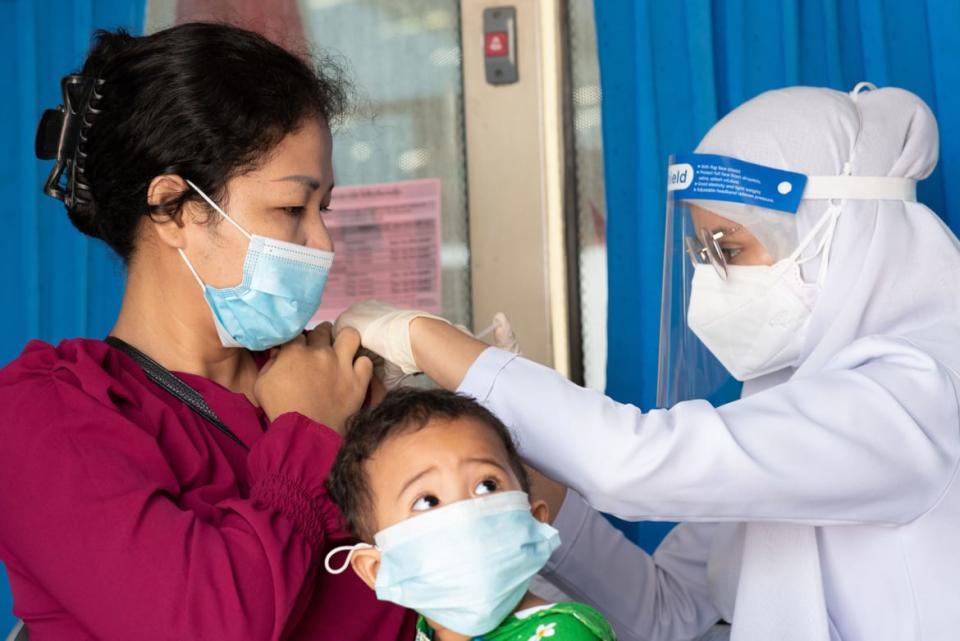 <div class="inline-image__caption"><p>A medical worker gives a COVID vaccine to a citizen in Bangkok. Health officials have also detected XE in Thailand.</p></div> <div class="inline-image__credit">Teera Noisakran/Getty</div>