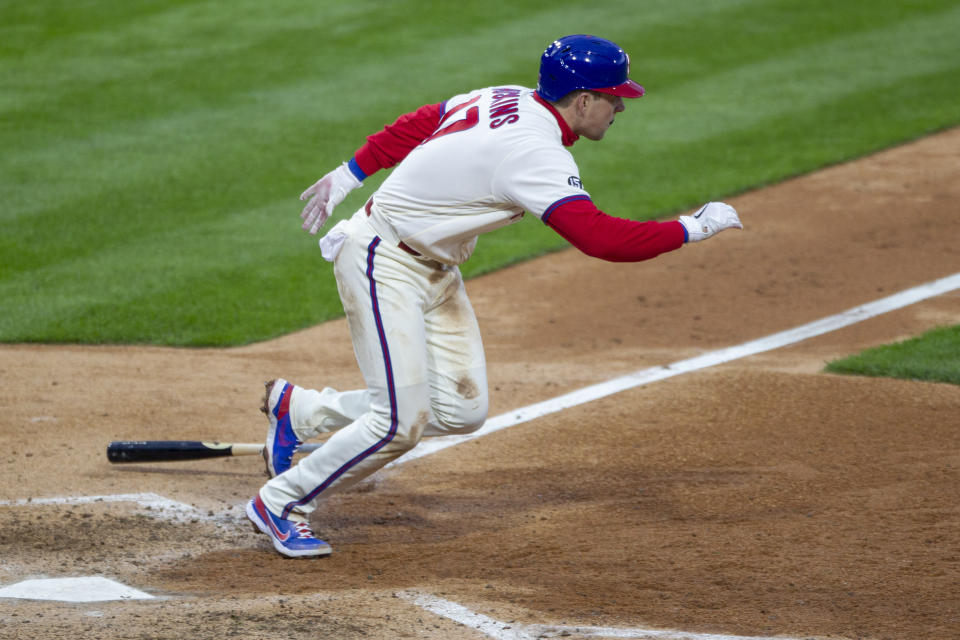 Philadelphia Phillies' Rhys Hoskins (17) runs to first on a single during the fifth inning of a baseball game against the St. Louis Cardinals, Saturday, April 17, 2021, in Philadelphia. (AP Photo/Laurence Kesterson)