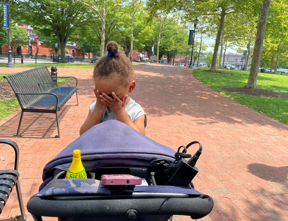 Chanel Harris sits with her son, Lebron, in Tubman Garrett Riverfront Park, in Wilmington, Delaware, on July 12, 2023.