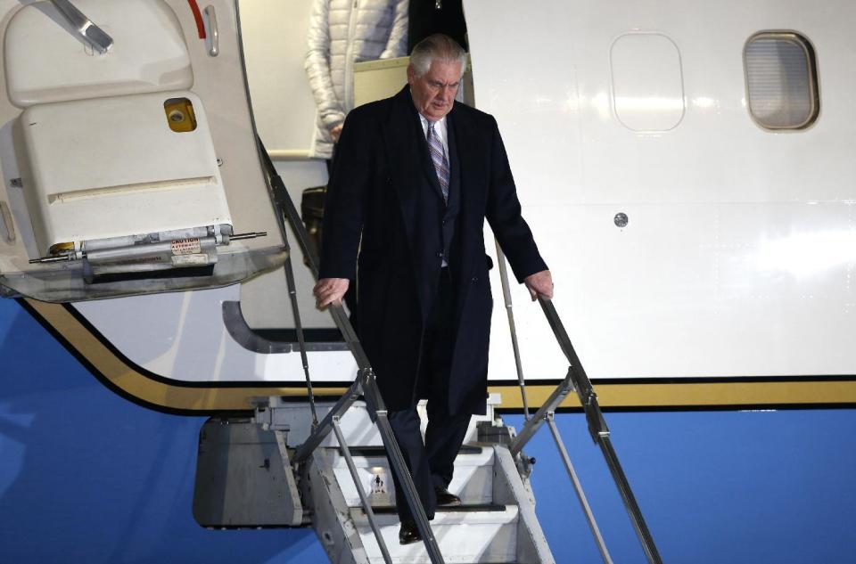 U.S. Secretary of State Rex Tillerson, center, arrives at Haneda international airport in Tokyo, as the first stop of his tour to Asia, Wednesday, March 15, 2017. (Toru Hanai/Pool Photo via AP)