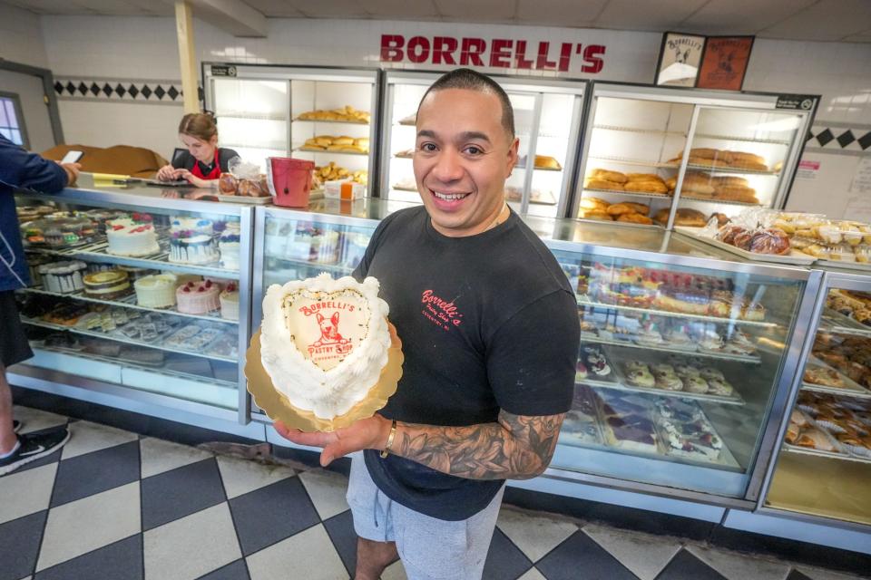 Brayn Boza with a heart-shaped Borrelli's Burn Away Cake.