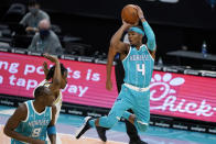 Charlotte Hornets guard Devonte' Graham looks to pass the ball during the first half of the team's NBA basketball game against the Dallas Mavericks in Charlotte, N.C., Wednesday, Jan. 13, 2021. (AP Photo/Chris Carlson)