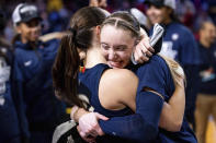 UConn guard Paige Bueckers, right, hugs guard Nika Muhl after their win over Southern California in an Elite Eight college basketball game in the women's NCAA Tournament, Monday, April 1, 2024, in Portland, Ore. (AP Photo/Howard Lao)