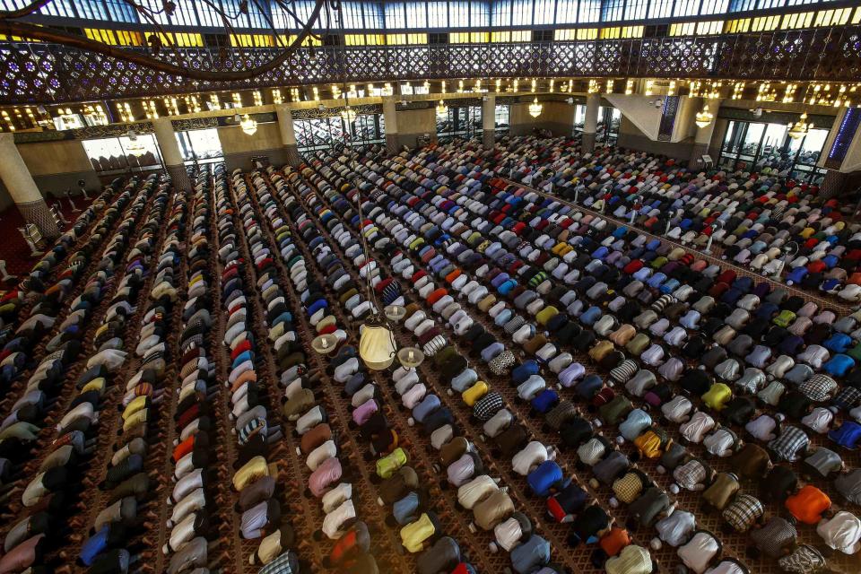 Muslims attend Friday prayers at the National Mosque in Kuala Lumpur