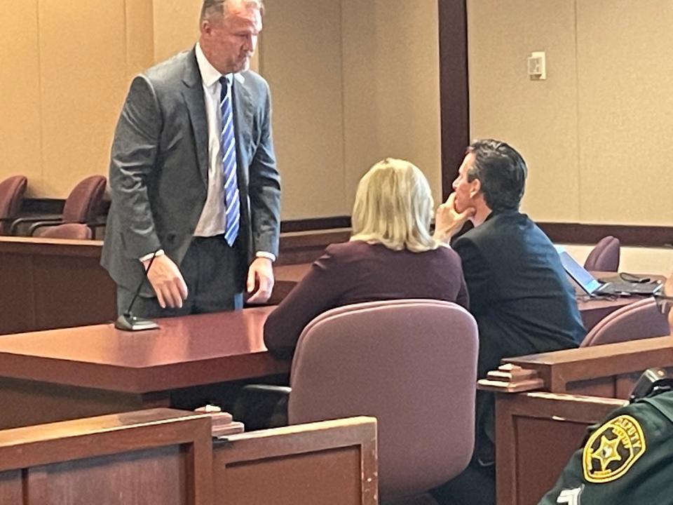 Defense lawyer John Spivey, standing, speaks with Assistant State Attorneys Amy Berndt and Rich Buxman at Thursday's trial.