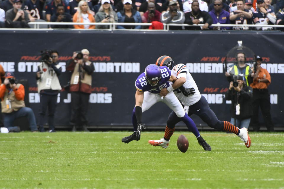 Minnesota Vikings free safety Harrison Smith reaches for a fumble as Chicago Bears quarterback Chase Daniel defends during the half of an NFL football game Sunday, Sept. 29, 2019, in Chicago. The Bears recovered the fumble. (AP Photo/Matt Marton)