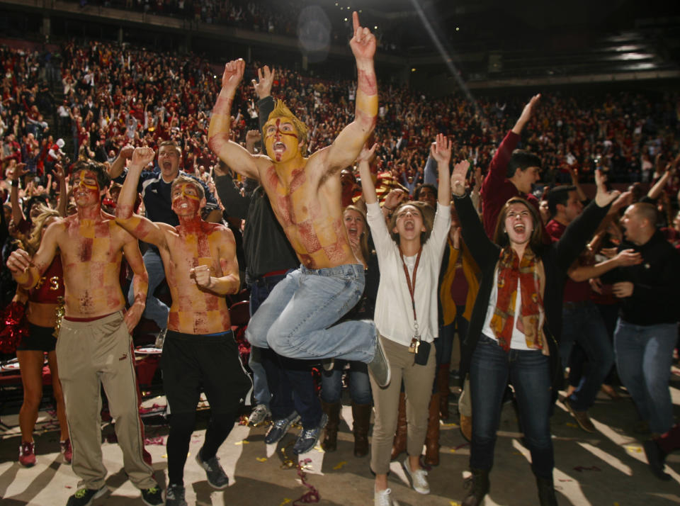 Florida State fans react as they watch a touchdown in the final seconds of the BCS Championship football game between Florida State and Auburn on a 30-foot screen at the Tallahassee Leon County Civic Center on Monday, Jan. 6, 2014, in Tallahassee, Fla. Florida State beat Auburn 34-31. (AP Photo/Phil Sears)