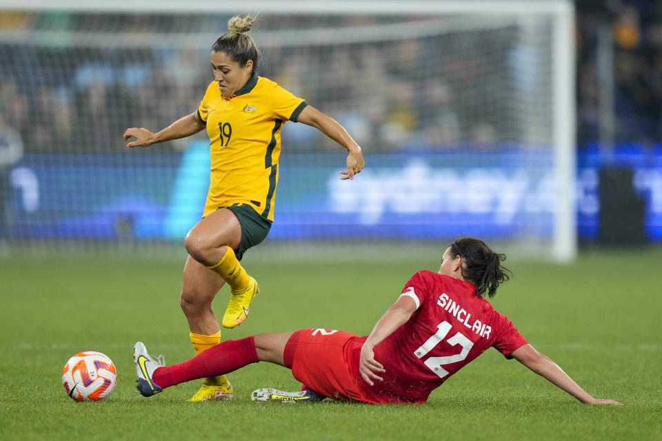 Canada's Christine Sinclair tackles Australia's Katrina Gorry, left, during a friendly soccer international between Canada and Australia in Sydney, Australia, Tuesday, Sept. 6, 2022. (AP Photo/Rick Rycroft)