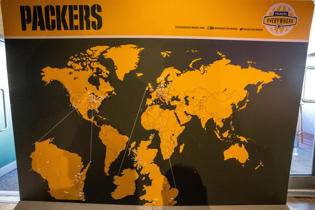 Fans attending the last of three pep rallies put on by the Green Bay Packers placed flags on a world map Oct. 8, 2022, in London. Two years after the Packers played the Giants in London, they're heading to Brazil for another interntional game.