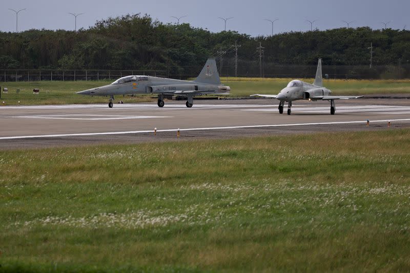 Two F-5 fighter jets are seen during practice at Chihhang Air Base in Taitung