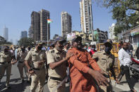 Activists shout slogans as police detain them during a protest against new farm laws in Mumbai, India, Wednesday, Jan. 27, 2021. Leaders of a protest movement sought Wednesday to distance themselves from a day of violence when thousands of farmers stormed India's historic Red Fort, the most dramatic moment in two months of demonstrations that have grown into a major challenge of Prime Minister Narendra Modi’s government. (AP Photo/Rafiq Maqbool)