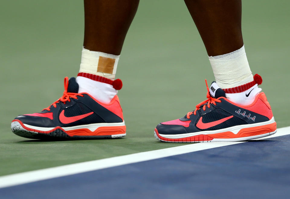 NEW YORK, NY - AUGUST 26: The shoes of Serena Williams of the United States of America seen during her women's singles first round match against Francesca Schiavone of Italy on Day One of the 2013 US Open at USTA Billie Jean King National Tennis Center on August 26, 2013 in the Flushing neighborhood of the Queens borough of New York City.  (Photo by Elsa/Getty Images)