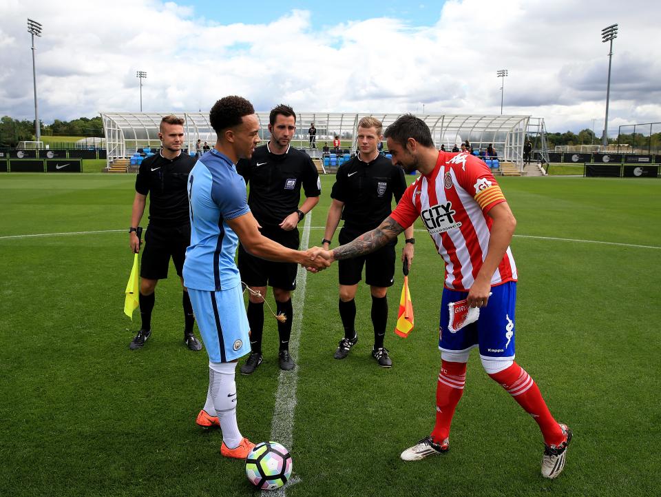 Manchester City U19 captain Shay Facey shakes hands with Girona captain Richy in their 2016 pre-season friendly