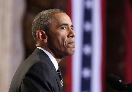 U.S. President Barack Obama pause while speaking about immigration reform at the Copernicus Community Center in Chicago November 25, 2014. REUTERS/Larry Downing