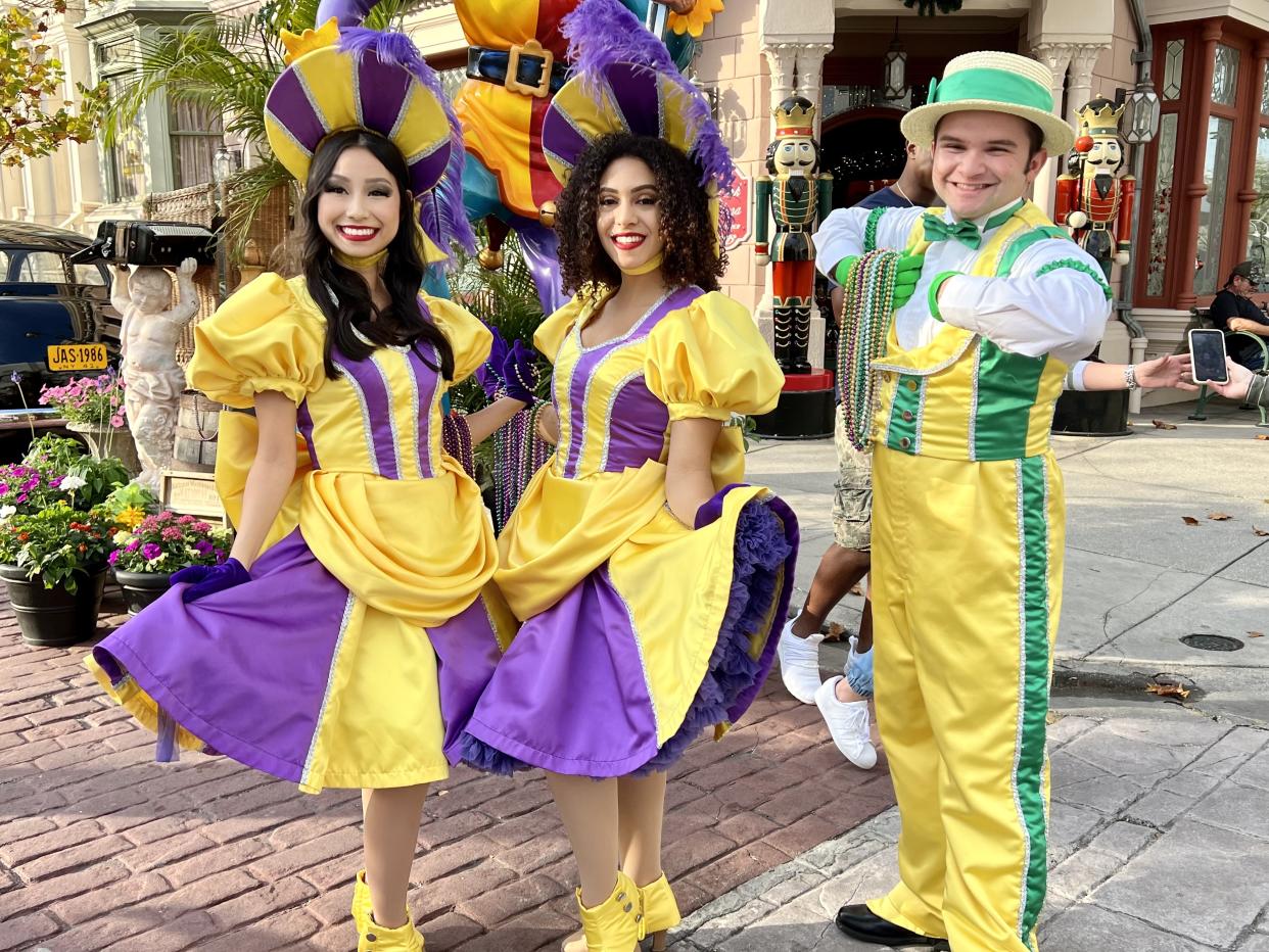 Street performers in colorful costumes make their rounds each evening during Mardi Gras, interacting with guests and passing out ... more beads. (Photo: Terri Peters)