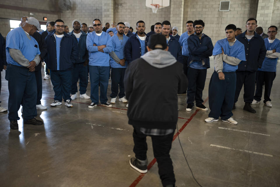 Rapper Bobby Gonzalez, 34, performs in front of a group of prisoners at Valley State Prison's gymnasium in Chowchilla, Calif., Friday, Nov. 4, 2022. Gonzalez was released on parole from the prison in September of 2019, after serving 16 years of a 25-year sentence as a juvenile offender. He left a mark at the prison and on the California Department of Corrections and Rehabilitation, emerging as an established artist by the name of "Bobby Gonz." (AP Photo/Jae C. Hong)