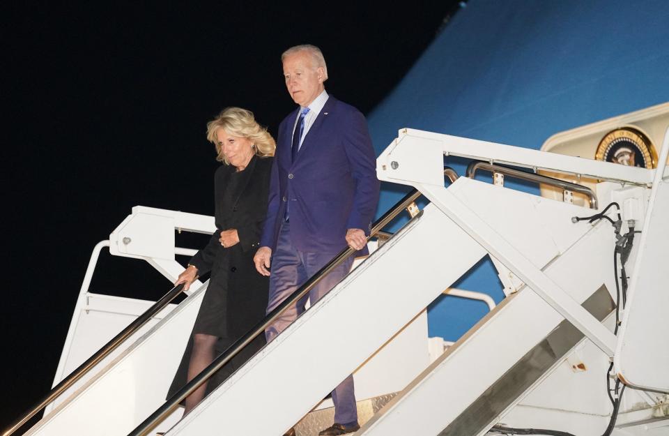 US President Joe Biden and first lady Jill Biden step from Air Force One upon arrival at Stansted Airport (REUTERS)