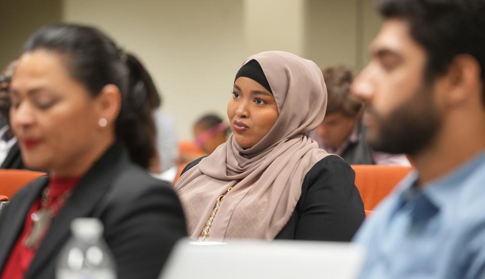 Ramla Fiqi listens to a presentation at the New American Leadership Academy event held Nov. 2 at the Jerry Hammond Center.