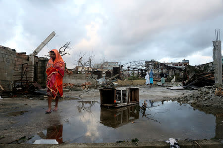 A woman walks on a street after a tornado ripped through a neighbourhood, in Havana, Cuba January 28, 2019. REUTERS/Fernando Medina