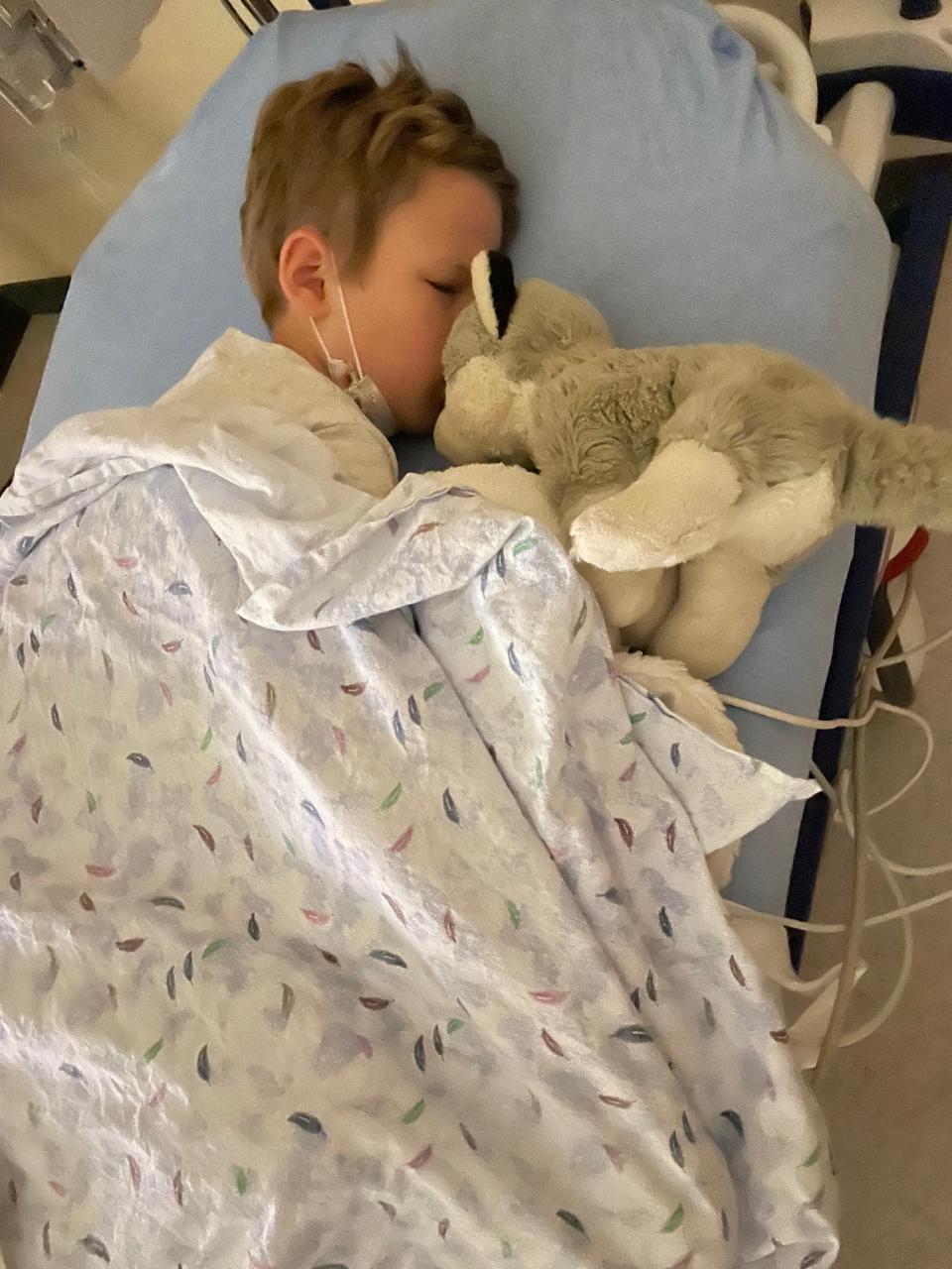 Sebastian Siniff had to wait for a bed when his parents rushed him to the hospital with a serious infection. Hospitals are crowded amid the tripledemic of COVID-19, flu and RSV.