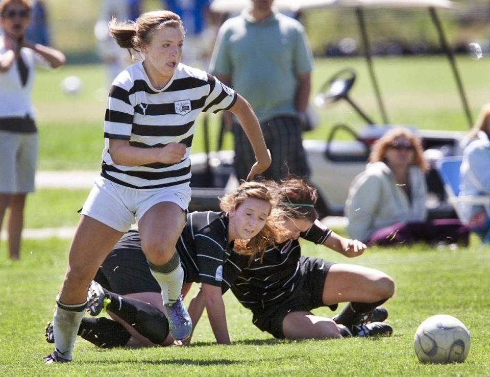 Sofia Huerta, left, leaves two defenders behind to set up an assist for the U-19 Super Nova at the 2011 U.S. Youth Soccer Far West Regional Championships in Boise.