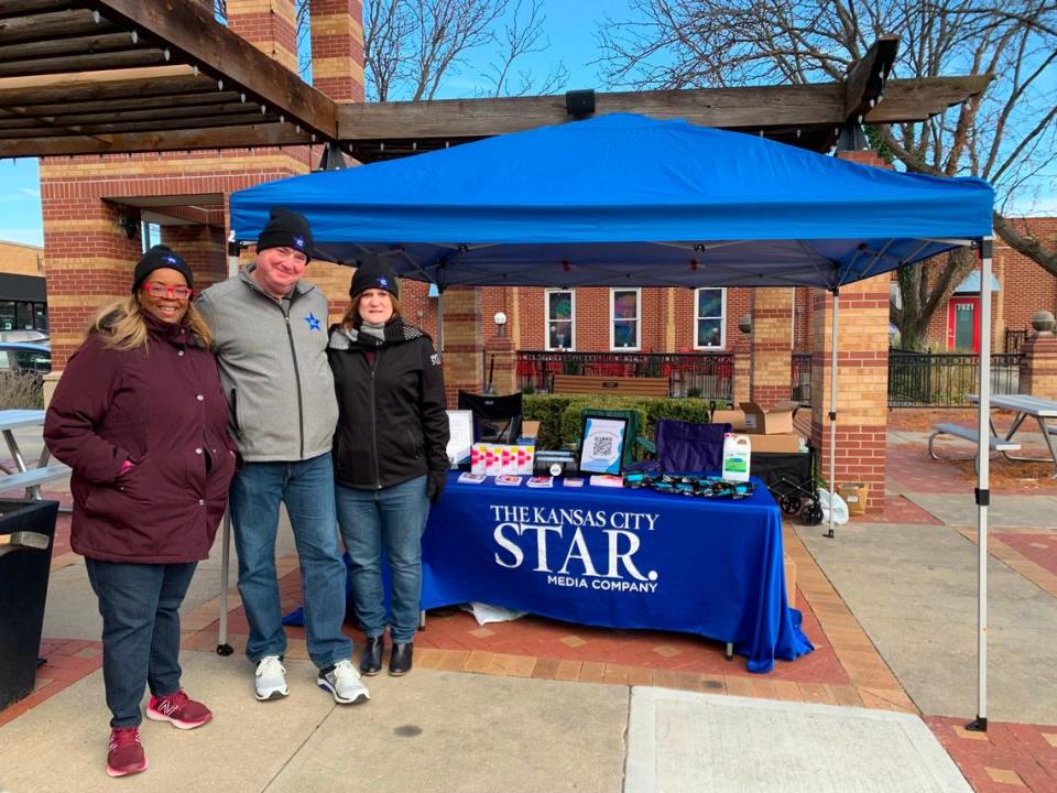 The Star’s Yvette Walker, Greg Farmer and Laura Bauer distribute naloxone and resource guides at the Overland Park Farmers Market.