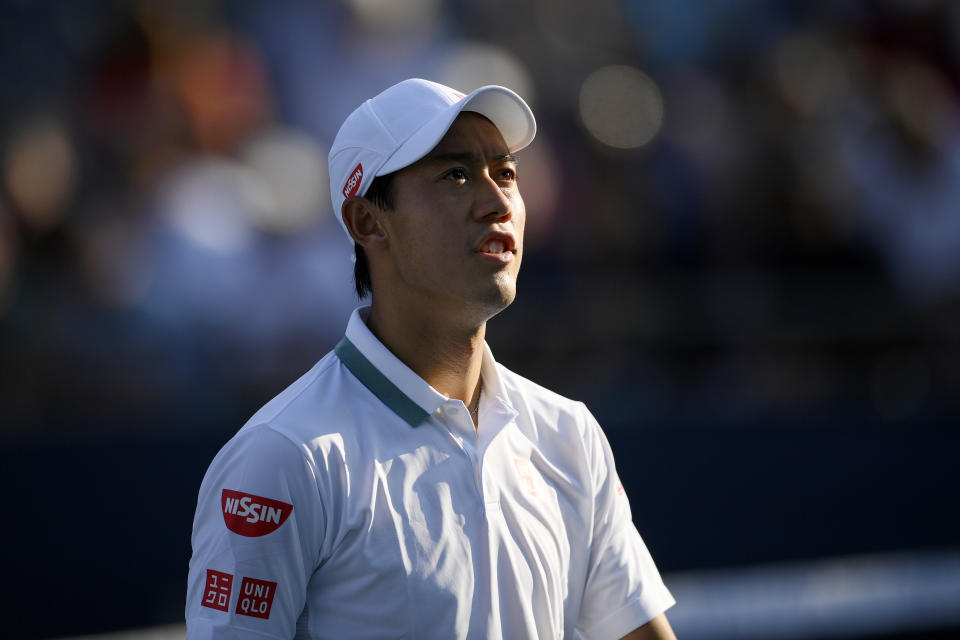 Kei Nishikori, of Japan, talks to the chair umpire during a match against Alexander Bublik, of Kazakhstan, at the Citi Open tennis tournament Wednesday, Aug. 4, 2021, in Washington. (AP Photo/Nick Wass)