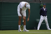 Australia's Nick Kyrgios reacts after losing a point to Greece's Stefanos Tsitsipas during a third round men's singles match on day six of the Wimbledon tennis championships in London, Saturday, July 2, 2022. (AP Photo/Kirsty Wigglesworth)