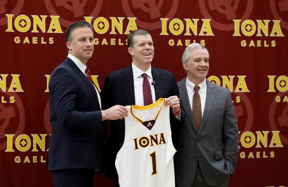 Tobin Anderson, center, the new men's basketball coach at Iona University is pictured with from left, Athletic Director Matthew Glovaski and President Seamus Carey, PhD., during a press conference at the school in New Rochelle, March 22, 2022.