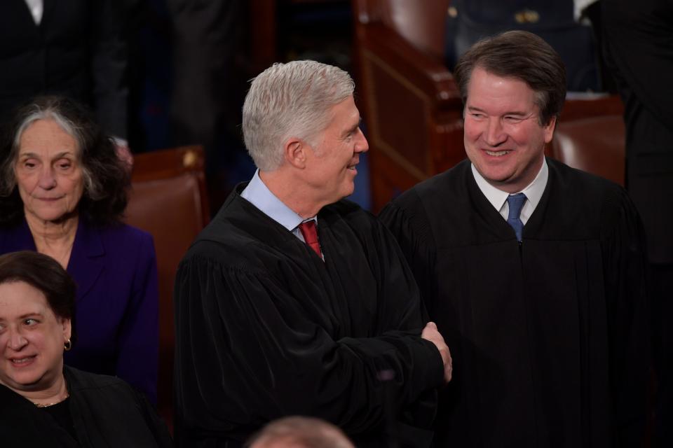 Associate Justices Neil M. Gorsuch and Brett M. Kavanaugh in the House chamber for the State of the Union address in Washington on Feb. 4, 2020.