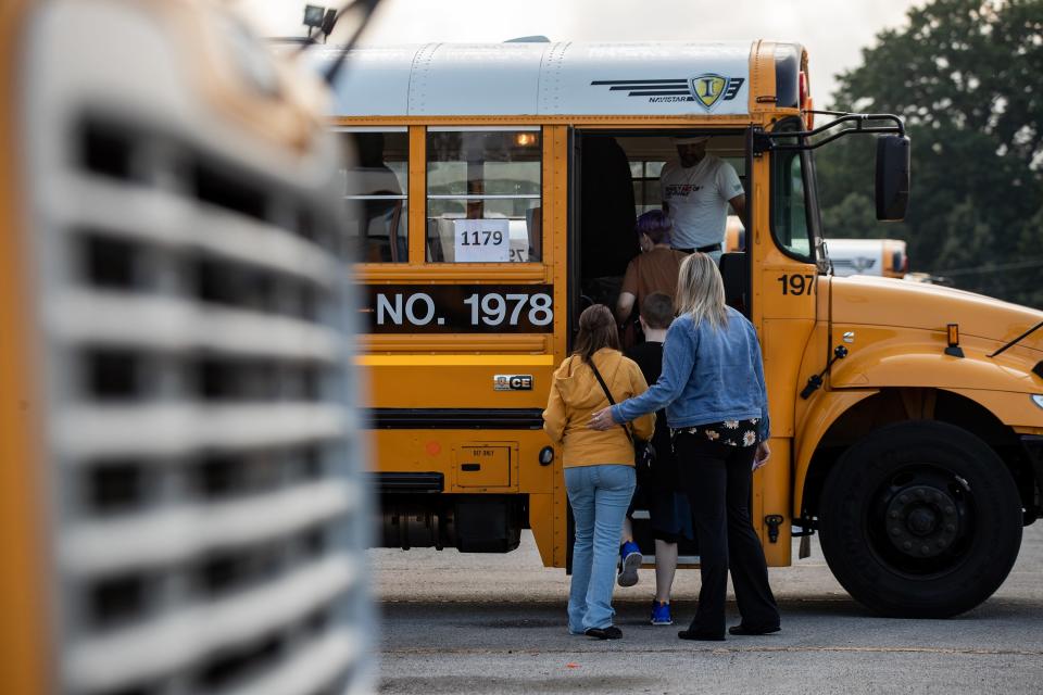JCPS employees helped students transfer buses at the Detrick Bus Compound on the first day of school on Wednesday, Aug. 9, 2023