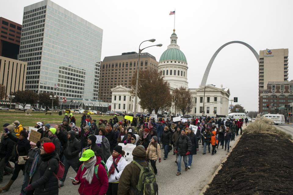 Demonstrators march to City Hall as they protest a grand jury's decision not to indict white police officer Darren Wilson for killing unarmed black teenager Michael Brown, in St. Louis, Missouri November 26, 2014. (REUTERS/Lucas Jackson)