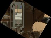 This view of the calibration target for the Mars Hand Lens Imager (MAHLI) aboard NASA's Mars rover Curiosity combines two images taken by that camera during the 34th Martian day, or sol, of Curiosity's work on Mars. This image was taken Sept. 9