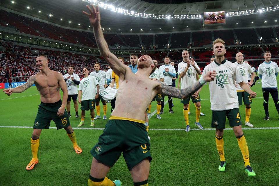 Socceroos players, pictured here celebrating after beating Peru to qualify for the World Cup.