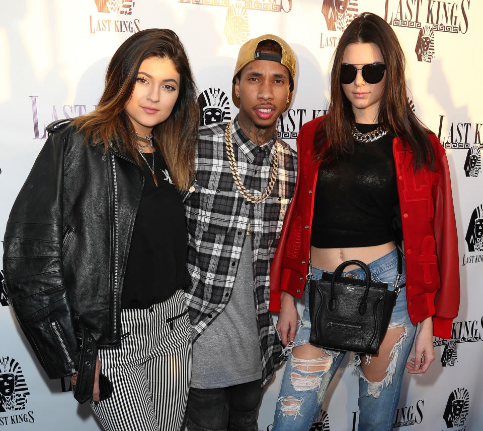 Close-up of Kylie, Tyga, and Kendall at a media event