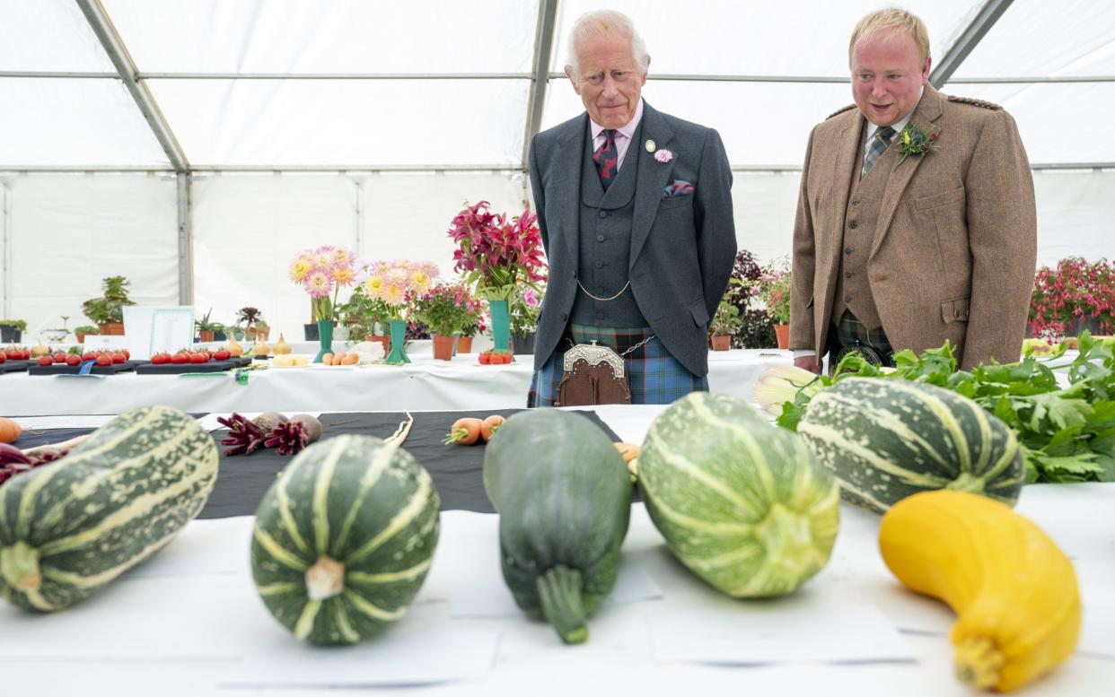 The King views the vegetable competition with Brian Grant, chairman of the Royal Horticultural Society of Aberdeen