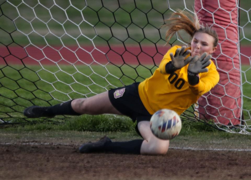 The Palm Desert High School goalie Riley Wilson makes a save on a penalty kick in an overtime shootout of their CIF playoff win against Paloma Valley in Palm Desert, Calif., Feb. 8, 2024.