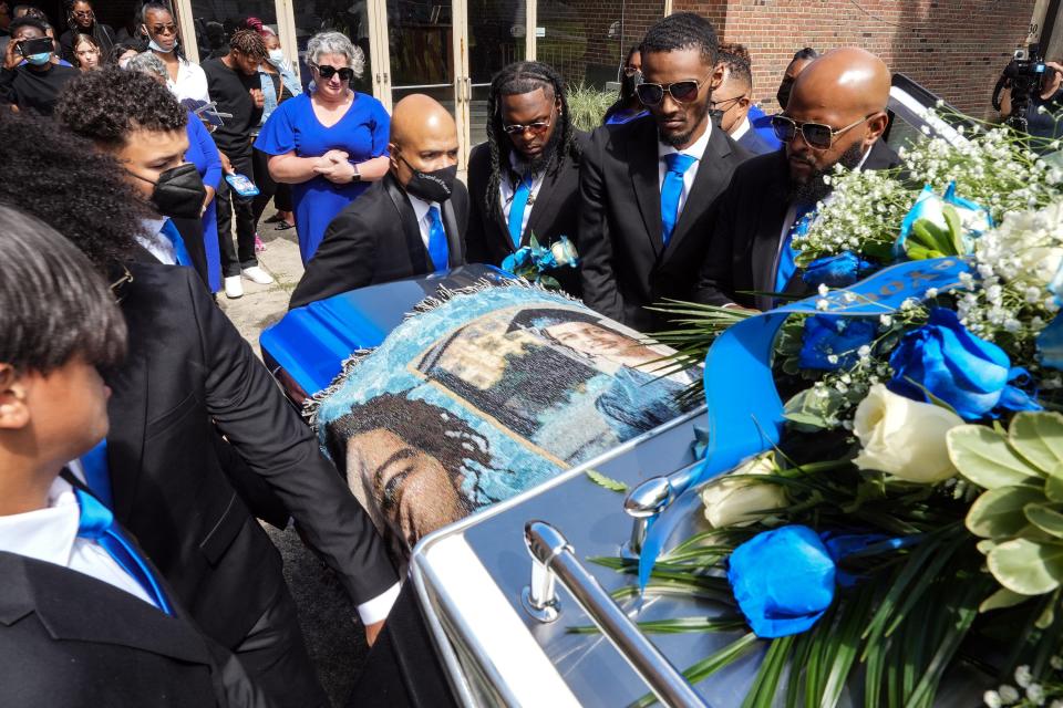 Rebecca Duran, Donovan Lewis' mother, watches as her son's casket is moved into a hearse following a funeral service Saturday at Christian Valley Missionary Baptist Church in Columbus. Lewis was fatally shot by Columbus police officer Ricky Anderson on Aug. 30.