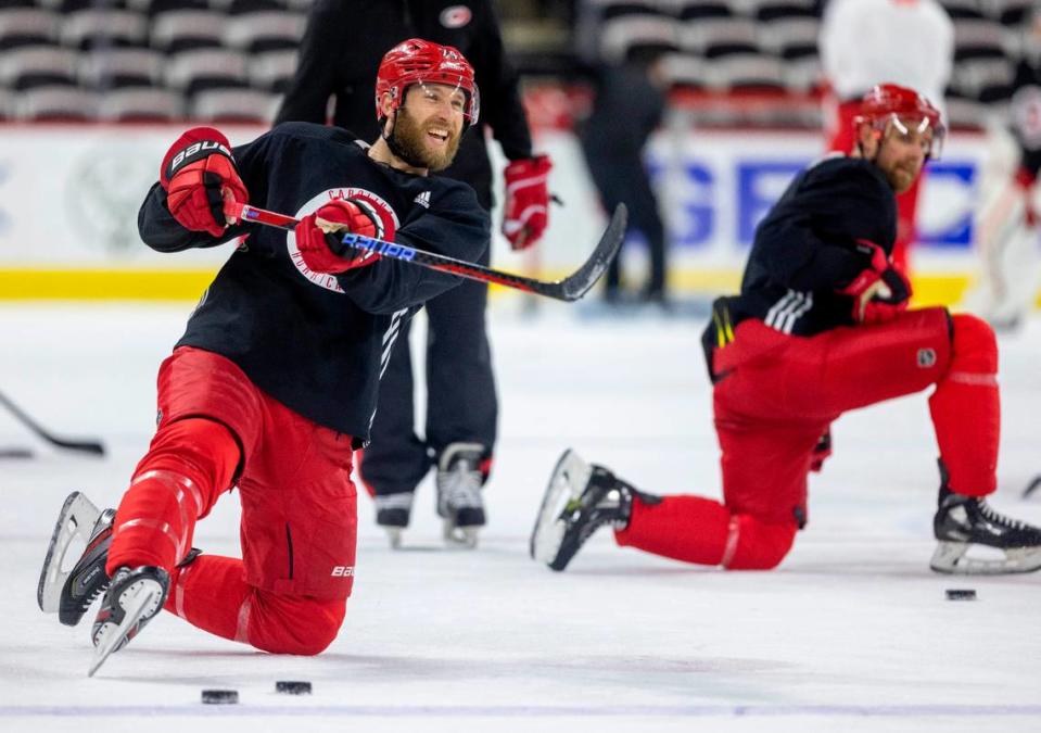 The Carolina Hurricanes Jaccob Slavin (74) shoots from the kneeling position during practice on Wednesday, May 17, 2023 at PNC Arena in Raleigh, N.C. Robert Willett/rwillett@newsobserver.com