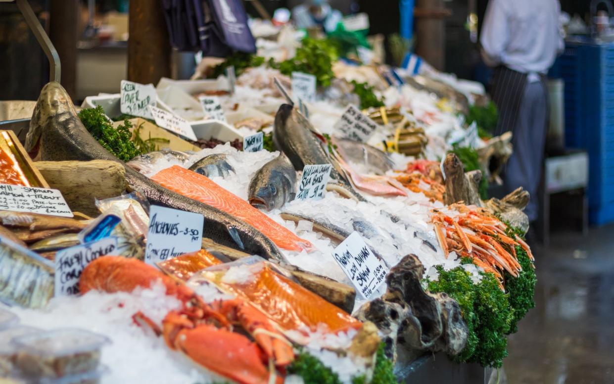 Variety of fish displayed on ice at a fishmonger in Borough Market in London