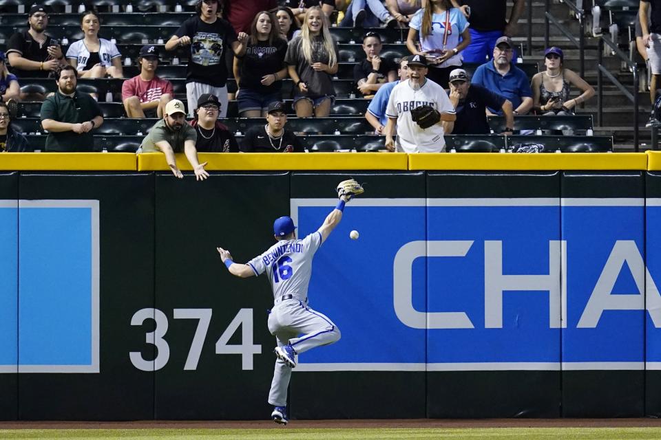 Kansas City Royals left fielder Andrew Benintendi is unable to make a play on a double by Arizona Diamondbacks' Daulton Varsho during the sixth inning of a baseball game Tuesday, May 24, 2022, in Phoenix. (AP Photo/Ross D. Franklin)