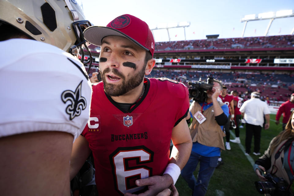 Tampa Bay Buccaneers quarterback Baker Mayfield (6) greets New Orleans Saints players after an NFL football game in Tampa, Fla., Sunday, Dec. 31, 2023. The Saints won 23-13. (AP Photo/Chris O'Meara)