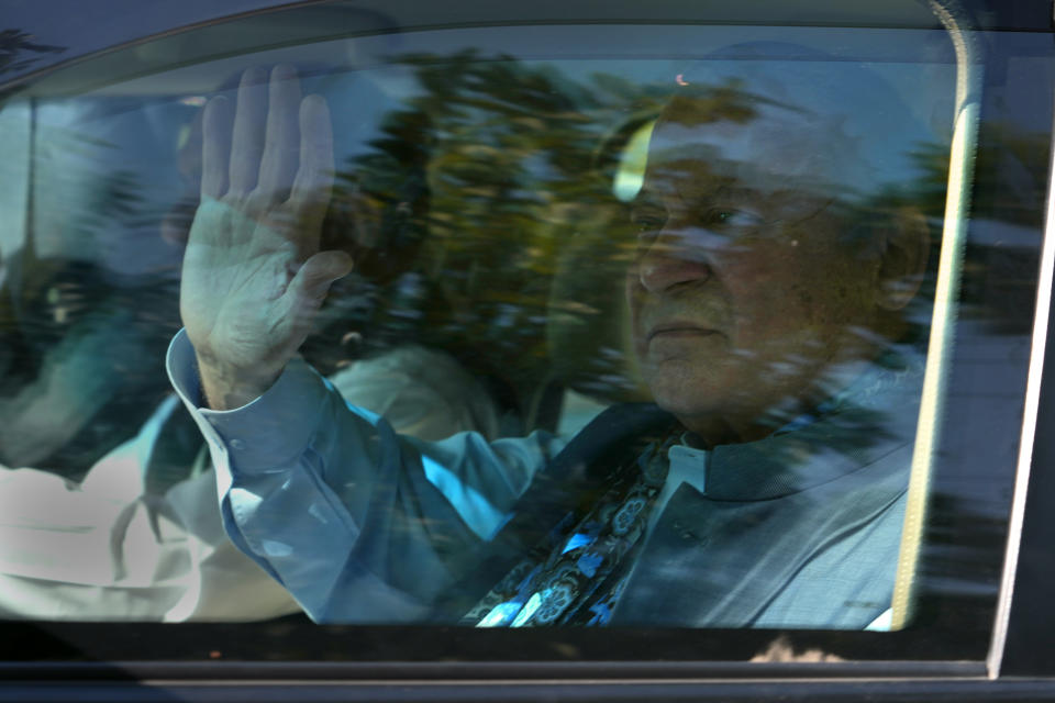 Pakistan's former Prime Minister Nawaz Sharif waves to his supporters from a vehicle as he leaves after appearing in a court in Islamabad, Pakistan, Tuesday, Oct. 24, 2023. Sharif returned to Pakistan on last Saturday, ending his four years of self-imposed exile in London. Sharif is facing multiple legal challenges. A Pakistani federal court on last Thursday granted him bail until Oct. 24, giving him protection from arrest until then. (AP Photo/Anjum Naveed)