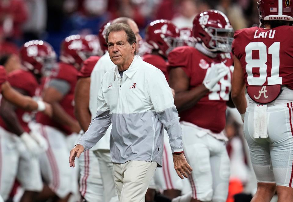 Alabama coach Nick Saban watches players warm-up for the College Football Playoff championship NCAA football game against Georgia on Jan. 10, 2022.