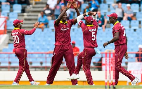 West Indies celebrate the wicket of Joe Root - Credit: afp