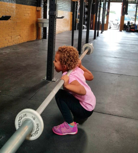 She picked up her first weights when she was 14 months old. Photo: Instagram