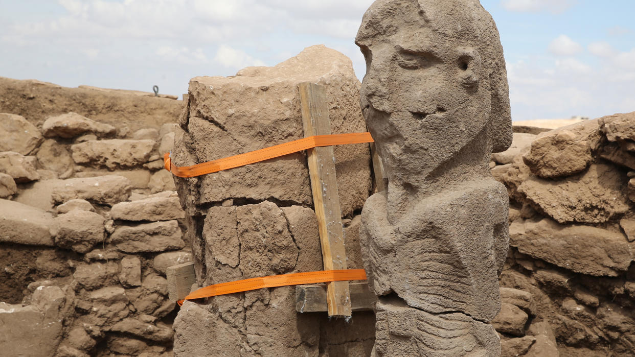   A view of 2.3-meter high human statue, which is a candidate for one of the most impressive examples of prehistoric art with a realistic facial expression, was found fixed to the ground on a bench during excavations in Karahantepe site in Sanliurfa, Turkiye on October 01, 2023. 