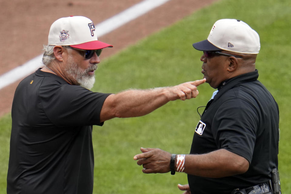 Pittsburgh Pirates manager Derek Shelton, left, questions a call at third base with umpire Liz Diaz during the fourth inning of a baseball game against the St. Louis Cardinals in Pittsburgh, Thursday, July 4, 2024. (AP Photo/Gene J. Puskar)