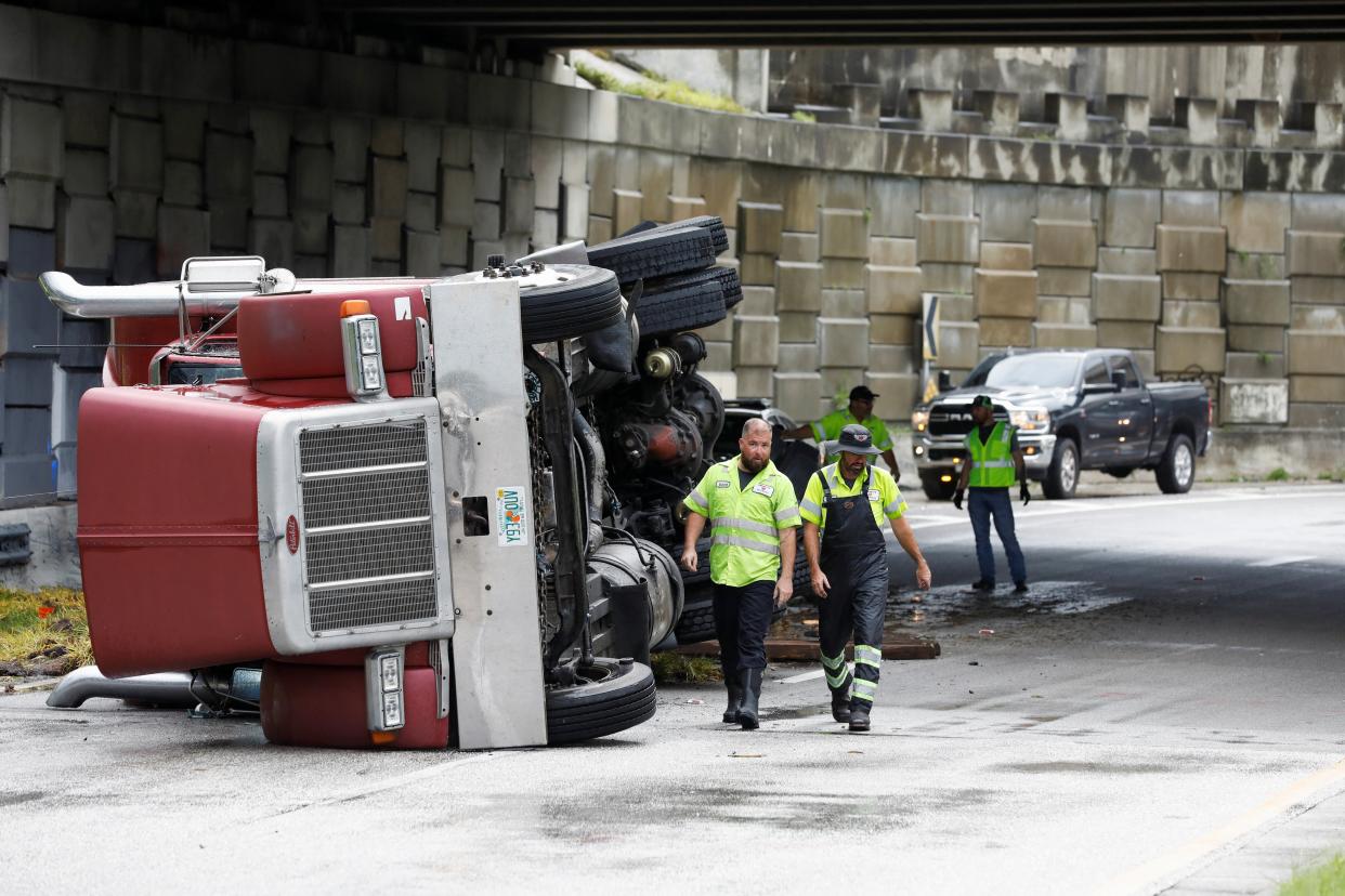 A transfer truck lies overturned on Independence Parkway in Tampa, as Hurricane Debby moves north of central Florida, August 5, 2024. (REUTERS)